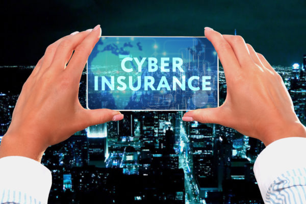 The concept of business, technology, the Internet and the network. Business lady looks at the virtual screen of your smartphone and sees the inscription: Cyber insurance