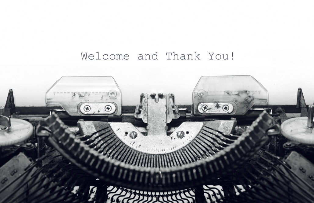 Welcome and thank you graphic with typewriter in background.